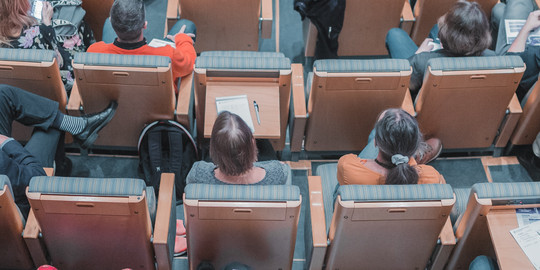 People sitting at a conference.