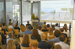 Lenka Slavíková presenting in front of audience